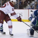 Arizona Coyotes left wing Craig Cunningham (22) tries to get a shot past Vancouver Canucks goalie Eddie Lack (31) during the first period of an NHL hockey game Thursday, April 9, 2015, in Vancouver, British Columbia. (AP Photo/The Canadian Press, Jonathan Hayward)
