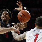 Stanford guard Chasson Randle (5) is fouled by Arizona guard Gabe York during the first half of an NCAA college basketball game, Saturday, March 7, 2015, in Tucson, Ariz. (AP Photo/Rick Scuteri)
