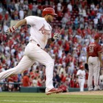St. Louis Cardinals shortstop Jhonny Peralta, left, rounds the bases after hitting a walk-off home run off Arizona Diamondbacks relief pitcher J.C. Ramirez, right, during the 10th inning of a baseball game Monday, May 25, 2015, in St. Louis. The Cardinals won 3-2. (AP Photo/Jeff Roberson)