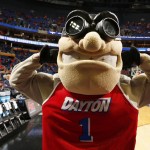  Dayton's mascot poses for photographs before Dayton's third-round game against Syracuse in the NCAA men's college basketball tournament in Buffalo, N.Y., Saturday, March 22, 2014. (AP Photo/Bill Wippert)