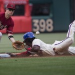 Philadelphia Phillies' Odubel Herrera steals second as Arizona Diamondbacks second baseman Aaron Hill waits for the ball in the eighth inning of a baseball game, Sunday, May 17, 2015, in Philadelphia. Cameron Rupp struck out swinging on the play. The Phillies won 6-0. (AP Photo/Laurence Kesterson)