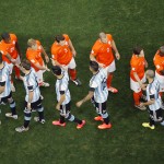Argentine and Dutch players greet each other prior to their World Cup semifinal soccer match at the Itaquerao Stadium in Sao Paulo, Brazil, Wednesday, July 9, 2014. (AP Photo/Fabrizio Bensch, Pool)