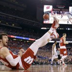 Wisconsin's Frank Kaminsky (44) reacts as he falls during the first half of the NCAA Final Four college basketball tournament championship game against Duke Monday, April 6, 2015, in Indianapolis. (AP Photo/Michael Conroy)