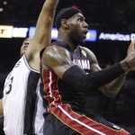  Miami Heat forward LeBron James, right, gets past San Antonio Spurs forward Boris Diaw too shoot during the first half in Game 5 of the NBA basketball finals on Sunday, June 15, 2014, in San Antonio. (AP Photo/David J. Phillip)