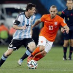 Argentina's Lionel Messi, left, tries to get around Netherlands' Wesley Sneijder, right, during the World Cup semifinal soccer match between the Netherlands and Argentina at the Itaquerao Stadium in Sao Paulo Brazil, Wednesday, July 9, 2014. (AP Photo/Victor R. Caivano)