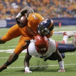 UTSA's Jarveon Williams (2) is upended by Arizona's Jonathan McKnight, bottom, during the second half of an NCAA college football game, Thursday, Sept. 4, 2014, in San Antonio. (AP Photo/Eric Gay)