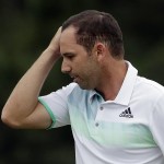 Sergio Garcia, of Spain, wipes his forehead on the 18th hole after finishing his fourth round of the Masters golf tournament Sunday, April 12, 2015, in Augusta, Ga. (AP Photo/Chris Carlson)