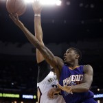 Phoenix Suns guard Archie Goodwin goes to the basket against New Orleans Pelicans forward Anthony Davis, behind, in the first half of an NBA basketball game in New Orleans, Friday, April 10, 2015. (AP Photo/Gerald Herbert)
