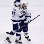 Tampa Bay Lightning's Ryan Callahan, right, is congratulated by teammate Alex Killorn after scoring during the first period in Game 3 of the NHL hockey Stanley Cup Final against the Chicago Blackhawks on Monday, June 8, 2015, in Chicago. (AP Photo/Charles Rex Arbogast)