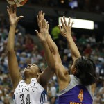 Minnesota Lynx forward Damiris Dantas (34) pushes up to the basket against Phoenix Mercury forward Candice Dupree (4) during the second half of Game 2 of the WNBA basketball Western Conference finals, Sunday, Aug. 31, 2014, in Minneapolis. The Lynx won 82-77. (AP Photo/Stacy Bengs)