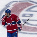 Montreal Canadiens' Brian Gionta skates off the ice following a game-winning goal by Boston Bruins' Matt Fraser during the first period overtime in Game 4 in the second round of the NHL Stanley Cup playoffs Thursday, May 8, 2014, in Montreal. (AP Photo/The Canadian Press, Paul Chiasson)