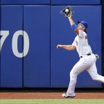 New York Mets center fielder Kirk Nieuwenhuis catches Jake Lamb's ninth-inning flyout with a runner on base in the Mets 5-3 victory over the Arizona Diamondbacks in a baseball game in New York, Sunday, July 12, 2015. Nieuwenhuis hit three home runs in the game, the tenth Met to achieve that, and the first to do it at home. (AP Photo/Kathy Willens)
