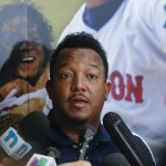 National Baseball Hall of Fame electee Pedro Martinez talks to members of the media during a news conference on Saturday, July 25, 2015, in Cooperstown, N.Y. Martinez will be inducted to the hall on Sunday. (AP Photo/Mike Groll)
