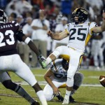 Southern Mississippi's Corey Acosta (25) has his field-goal attempt blocked in the second half of an NCAA college football game against Mississippi State in Starkville, Miss., Saturday, Aug. 30, 2014. Mississippi State won 49-0. (AP Photo/Rogelio V. Solis)