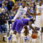 Grand Canyon's De'Andre Davis, bottom, is pressured by Kentucky's Aaron Harrison during the first half of an NCAA college basketball game, Friday, Nov. 14, 2014, in Lexington, Ky. (AP Photo/James Crisp)