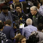Seattle Seahawks head coach Pete Carroll answers questions during media day for NFL Super Bowl XLIX football game Tuesday, Jan. 27, 2015, in Phoenix. (AP Photo/Charlie Riedel)
