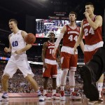 Duke's Marshall Plumlee (40) reacts to a call against Wisconsin during the second half of the NCAA Final Four college basketball tournament championship game Monday, April 6, 2015, in Indianapolis. (AP Photo/David J. Phillip)