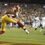 Washington Redskins wide receiver Andre Roberts (12) pulls in a touchdown pass during the second half of an NFL football game against the Seattle Seahawks in Landover, Md., Monday, Oct. 6, 2014. (AP Photo/Nick Wass)