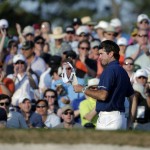 Spectators cheer as Bubba Watson walks up the 18th fairway during the third round of the Masters golf tournament Saturday, April 12, 2014, in Augusta, Ga. (AP Photo/Chris Carlson)