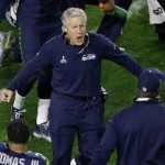 Seattle Seahawks head coach Pete Carroll celebrates after Seattle Seahawks middle linebacker Bobby Wagner intercepted the ball town by New England Patriots quarterback Tom Brady during the second half of NFL Super Bowl XLIX football game Sunday, Feb. 1, 2015, in Glendale, Ariz. (AP Photo/Charlie Riedel)