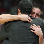 Arizona guard T.J. McConnell hugs head coach Sean Miller as he leaves the game against Wisconsin during the second half of a college basketball regional final in the NCAA Tournament, Saturday, March 28, 2015, in Los Angeles. Wisconsin beat Arizona 85-78 to advance to the Final Four. (AP Photo/Mark J. Terrill)