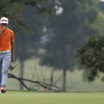 Rickie Fowler reacts after missing a birdie put on the 11th hole during the final round of the PGA Championship golf tournament at Valhalla Golf Club on Sunday, Aug. 10, 2014, in Louisville, Ky. (AP Photo/Jeff Roberson)