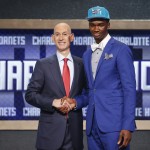Indiana's Noah Vonleh, right, poses for a photo with NBA Commissioner Adam Silver after being selected ninth overall by the Charlotte Hornets during the 2014 NBA draft, Thursday, June 26, 2014, in New York. (AP Photo/Jason DeCrow)