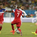 Ghana's Kevin-Prince Boateng, center. attempts to get the ball past United States' Kyle Beckerman, left, DaMarcus Beasley, No7 and United States' John Brooks during the group G World Cup soccer match between Ghana and the United States at the Arena das Dunas in Natal, Brazil, Monday, June 16, 2014. (AP Photo/Dolores Ochoa)