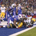 Green Bay Packers running back Eddie Lacy (27) is tackled by Buffalo Bills' Nigel Bradham (53) in the end zone for a safety during the second half of an NFL football game Sunday, Dec. 14, 2014, in Orchard Park, N.Y. The Bills won the game 21-13. (AP Photo/Gary Wiepert)