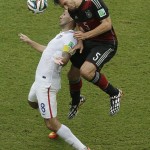 Germany's Mats Hummels heads the ball over United States' Clint Dempsey during the group G World Cup soccer match between the USA and Germany at the Arena Pernambuco in Recife, Brazil, Thursday, June 26, 2014. (AP Photo/Hassan Ammar)
