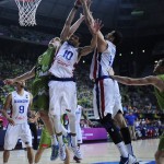 Dominican Republic's James Ferldeine, center, and Eloy Vargas, right, vies for the ball against Slovenia's Zoran Dragic, left, during Basketball World Cup Round of 16 match between Dominican Republic and Slovenia at the Palau Sant Jordi in Barcelona, Spain, Saturday, Sept. 6, 2014. The 2014 Basketball World Cup competition will take place in various cities in Spain from Aug. 30 through to Sept. 14. (AP Photo/Manu Fernandez)