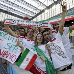 Iranian supporters react before the group F World Cup soccer match between Iran and Nigeria at the Arena da Baixada in Curitiba, Brazil, Monday, June 16, 2014 (AP Photo/Fernando Vergara)