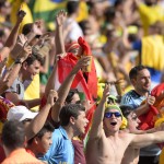 Spain's fans celebrate after Spain scored during the group B World Cup soccer match between Australia and Spain at the Arena da Baixada in Curitiba, Brazil, Monday, June 23, 2014. (AP Photo/Manu Fernandez)