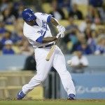 Los Angeles Dodgers' Howie Kendrick hits a single to score Justin Turner against the Arizona Diamondbacks during the seventh inning of a baseball game, Saturday, May 2, 2015, in Los Angeles. (AP Photo/Danny Moloshok)