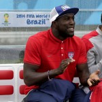United States' Jozy Altidore applauds his team as he sit on the bench during the group G World Cup soccer match between the United States and Germany at the Arena Pernambuco in Recife, Brazil, Thursday, June 26, 2014. (AP Photo/Julio Cortez)
