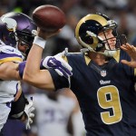 St. Louis Rams quarterback Austin Davis, right, throws as he is hit by Minnesota Vikings defensive end Brian Robison during the third quarter an NFL football game Sunday, Sept. 7, 2014, in St. Louis. (AP Photo/L.G. Patterson)