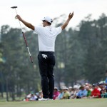  Defending Masters champion Adam Scott, of Australia, acknowledges applause on the 18th green following his fourth round of the Masters golf tournament Sunday, April 13, 2014, in Augusta, Ga. (AP Photo/Matt Slocum)