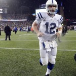 Indianapolis Colts quarterback Andrew Luck runs off the field after the NFL football AFC Championship game against the New England Patriots Sunday, Jan. 18, 2015, in Foxborough, Mass. The Patriots defeated the Colts 45-7 to advance to the Super Bowl against the Seattle Seahawks. (AP Photo/Julio Cortez)