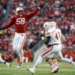 Wisconsin's Joe Schobert knocks down a pass by Nebraska quarterback Tommy Armstrong Jr. (4) during the first half of an NCAA college football game Saturday, Nov. 15, 2014, in Madison, Wis. (AP Photo/Morry Gash)