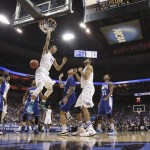 Kentucky forward Trey Lyles dunks during the first half of an NCAA tournament second round college basketball game against Hampton in Louisville, Ky., Thursday, March 19, 2015. Kentucky won the game 79-56. (AP Photo/David Stephenson)