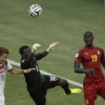 Germany's Mario Goetze, left, goes to head the ball as Ghana's goalkeeper Fatawu Dauda, centre, attempts to punch it clear as Ghana's Jonathan Mensah, looks on during the group G World Cup soccer match between Germany and Ghana at the Arena Castelao in Fortaleza, Brazil, Saturday, June 21, 2014. (AP Photo/Themba Hadebe)