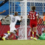 Ghana's Andre Ayew (10) watches as his shot goes past United States' goalkeeper Tim Howard, right, to score his side's first goal during the group G World Cup soccer match between Ghana and the United States at the Arena das Dunas in Natal, Brazil, Monday, June 16, 2014. (AP Photo/Julio Cortez)