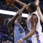 Oklahoma City Thunder forward Kevin Durant blocks a shot by Memphis Grizzlies forward Zach Randolph (50) in the first quarter of Game 2 of an opening-round NBA basketball playoff series in Oklahoma City, Monday, April 21, 2014. (AP Photo/Sue Ogrocki)
