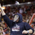 A Cleveland Cavaliers fan wears a LeBron James mask during the second half of an NBA basketball game against the Miami Heat, Thursday, Dec. 25, 2014, in Miami. The Heat defeated the Cavaliers 101-91. (AP Photo/Lynne Sladky)