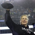 New England Patriots head coach Bill Belichick holds the championship trophy after the NFL football AFC Championship game Sunday, Jan. 18, 2015, in Foxborough, Mass. The Patriots defeated the Colts 45-7 to advance to the Super Bowl against the Seattle Seahawks. (AP Photo/Matt Slocum)