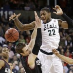  Michigan State's Branden Dawson (22) and Harvard's Laurent Rivard go for a loose ball in the second half during the third round of the NCAA men's college basketball tournament in Spokane, Wash., Saturday, March 22, 2014. Michigan State won 80-73. (AP Photo/Elaine Thompson)