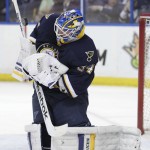 St. Louis Blues goalie Jake Allen (34) makes a save in the first period of an NHL hockey game against the Arizona Coyotes, Tuesday, Feb. 10, 2015, in St. Louis. (AP Photo/Tom Gannam)