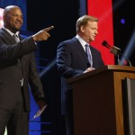 NFL commissioner Roger Goodell speaks before Shaun Williams, left, announces that the New York Giants selects Alabama defensive back Landon Collins as the 33rd pick in the second round of the 2015 NFL Football Draft, Friday, May 1, 2015, in Chicago. (AP Photo/Charles Rex Arbogast)
