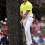 Rory McIlroy, of Northern Ireland, reacts after missing an eagle putt on the 15th green during the fourth round of the Masters golf tournament Sunday, April 12, 2015, in Augusta, Ga. (AP Photo/Charlie Riedel)