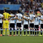 The Argentine national team line up for the national anthem before the World Cup semifinal soccer match between the Netherlands and Argentina at the Itaquerao Stadium in Sao Paulo Brazil, Wednesday, July 9, 2014. (AP Photo/Natacha Pisarenko)